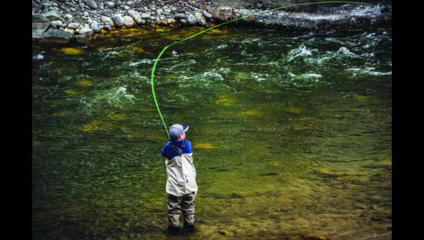 Christine Bakke A young fly fisherman practices his casting skills recently on the Stillwater River near Fireman’s Point. With temperatures expected to hit 75 by Saturday, the scene will most likely be replayed by many looking for a dose of river therapy.