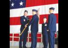 Maj. Gen. John Shanahan handds off the 55th Wing guidon to Col. Marty Reynolds (on the right) on June 1.